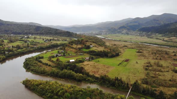 Aerial View of Crystal Clear Water in a Mountain Forest River with Pine Trees in Mountain Forest alt