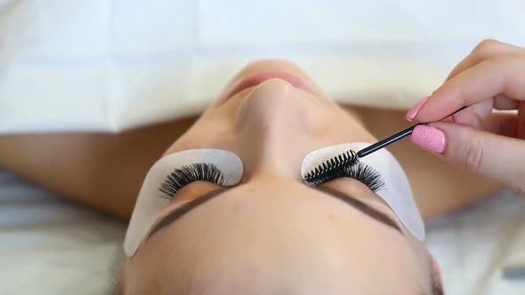 Eyelash Extension Procedure. Woman Eye with Long Eyelashes. Lashes, Close Up, Selective Focus. alt