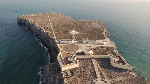Sagres Fortress, unique sea fort in Algarve, Portugal. Aerial orbiting shot alt