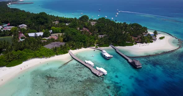 Daytime above abstract shot of a white paradise beach and aqua blue water background in high resolution alt