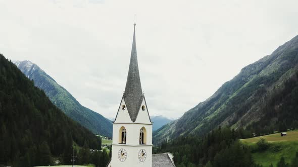 Panoramic View of a Picturesque Mountain Valley with a Village in a Lowland alt