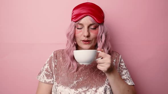 Sleepy Tired Pink Hair Woman Drinking Tea or Coffee in the Morning