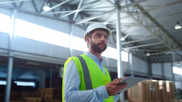 Portrait Focused Factory Employee Checking Tablet Information Inspecting Storage alt