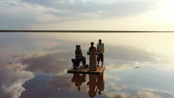 Beautiful Reflections of the Sunset Sky in Seawater, Band Is Performing,  alt