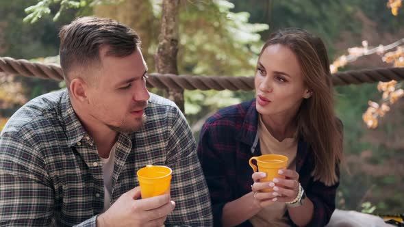 Hikers are Resting in Halt in Forest Man and Woman are Visiting Reserve at Autumn Day alt
