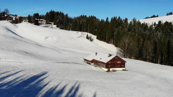 areal footage of an old farm house in Schwarzenberg, Bregenzerwald. alt