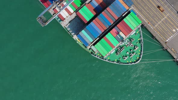 Top view of cargo ship in the port in Hong Kong alt