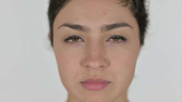 Close Up of Face of Indian Woman Looking at the Camera White Background alt