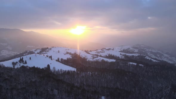 Aerial Drone View of a Snowy Sunset in Carpathian Mountains in Ukraine