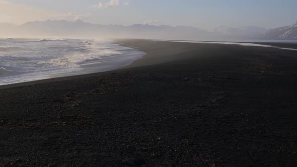 Iceland Beautiful Black Sand Beach Ocean Shoreline With Mountains