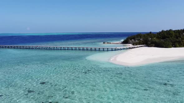 Aerial View of a Tropical Paradise Island Bay Covered in Limestone Trees with Crystal Clear Beach