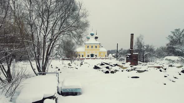 Snowcovered Winter Village Landscape with a Stove on the Ashes Aerial View alt