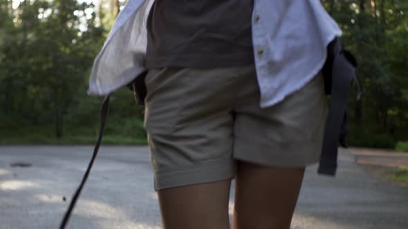 Tourist Traveler Girl In A Hat Walks In The Forest With A Phone In Her Hands, Tourist Girl Walks alt