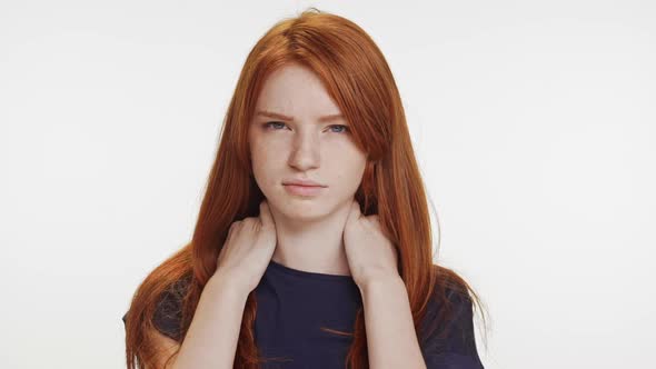 Upset Caucasian Foxy Teenage Girl in Dark Blue Tshirt Touching Neck Looking at Camera Screaming Why alt