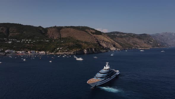 Private huge luxury yacht at the anchorage, aerial view.