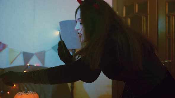 A Girl Takes Pictures or Takes Pictures on Her Friends' Phone for Halloween alt