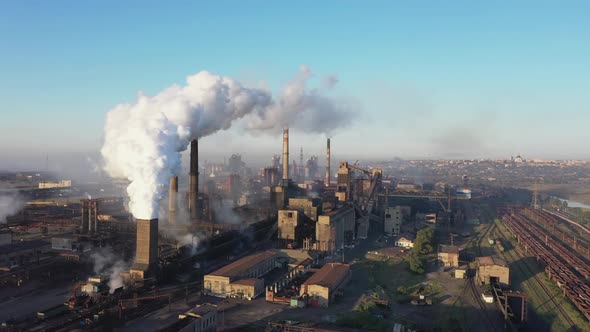 White smoke from the chimneys of a steel mill alt