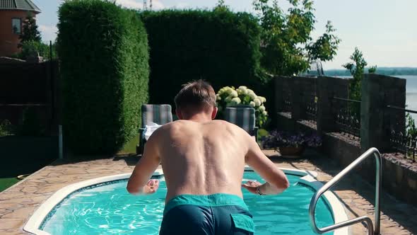 Guy Jumps Into the Pool