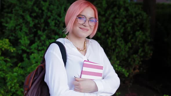 Portrait of a Female Student with Pink Hair alt
