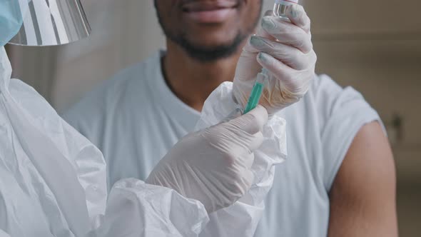 Young Afro Male Patient African American Man Smiling Says Yes Satisfied Looking at Hands in Latex alt