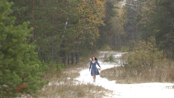Girl in Forest and First Snow