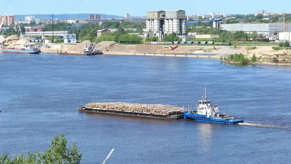 A Barge Transports Cargo on the River in the Summer