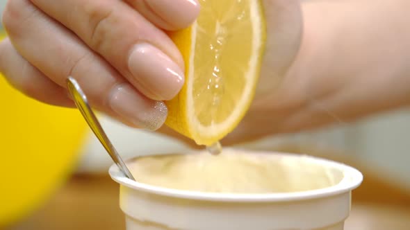 squeezing the lemon into the custard alt