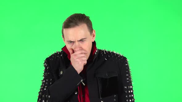 Guy Got a Cold, Sore Throat and Head, Cough on Green Screen at Studio alt