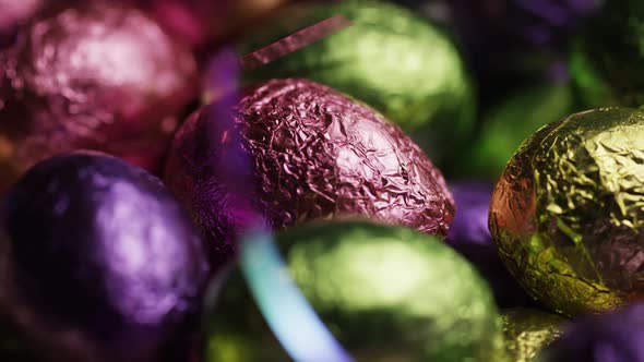 Rotating shot of colorful Easter candies on a bed of easter grass  alt