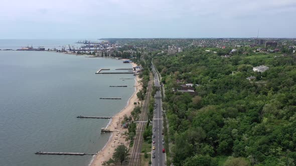 Drone point of view. Panoramic view of the embankment of the seaside town.
