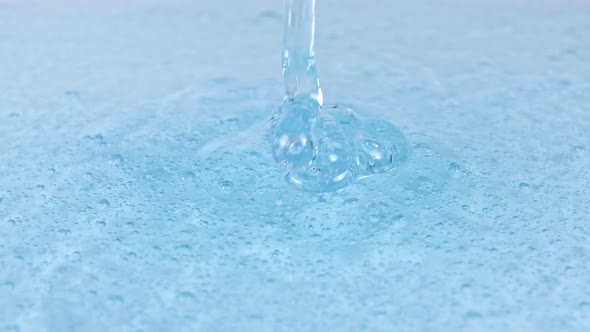 Pouring Transparent Blue Cosmetic Gel Cream With Molecule Bubbles alt