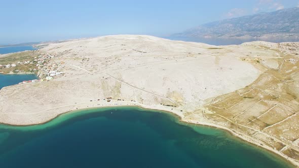Flying above isolated beach of Pag island, Croatia alt
