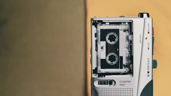 Portable Retro Tape Recorder with Micro Cassette Rec Sound on Yellow Background alt