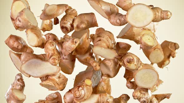 Super Slow Motion Shot of Flying Fresh Ginger Cuts at 1000 Fps alt