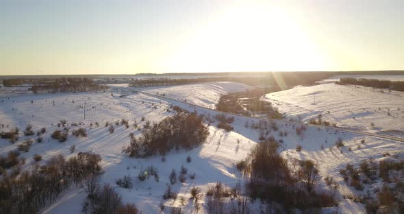 Car On Winter Road At Sunset