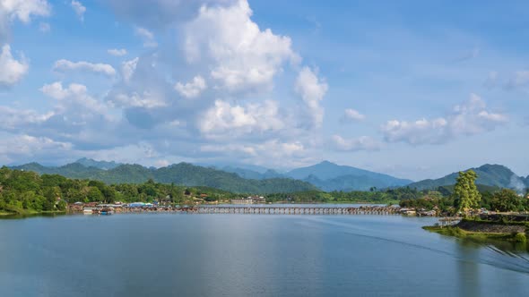 Mon Bridge, longest wooden bridge in Sangkhlaburi, sunny day, Kanchanaburi, Thailand - Time Lapse