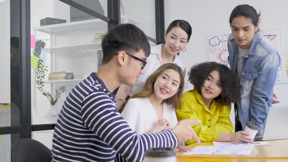 Group of asian young creative happy people entrepreneur on a business meeting office alt