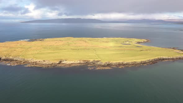 Aerial View of an Rainbow Above the Atlantic Ocean and Inishkeel By Portnoo in Donegal  Ireland alt