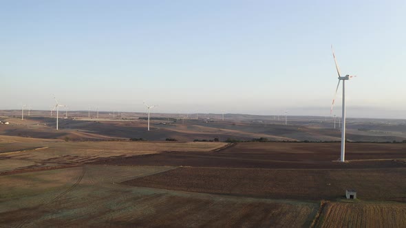 Wind turbine farm on beautiful morning landscape