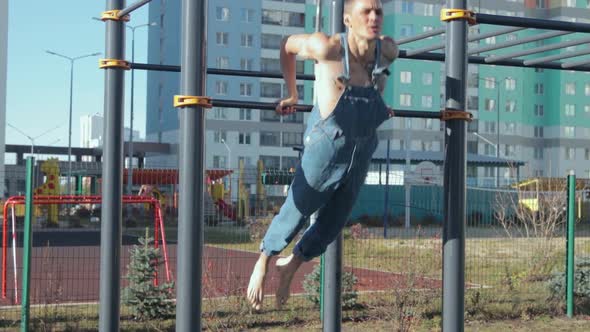 A man exercising on a sports ground