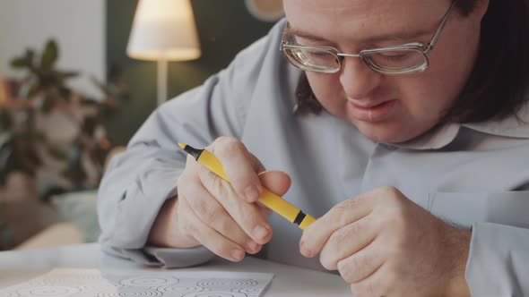 Man with Down Syndrome Drawing Picture alt