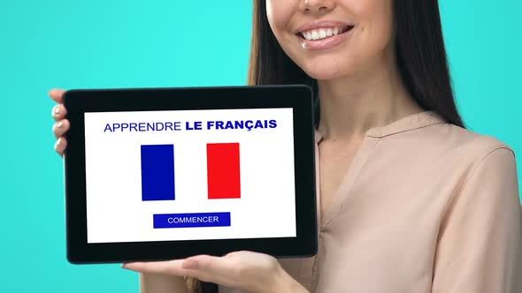 Joyful Female Holding Tablet With Learn French Language Test, Educational App alt