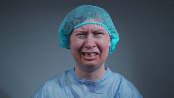 Stressful Tearstained Woman with Injuries to Her Face and Teeth Cries in Hospital Before Surgery alt
