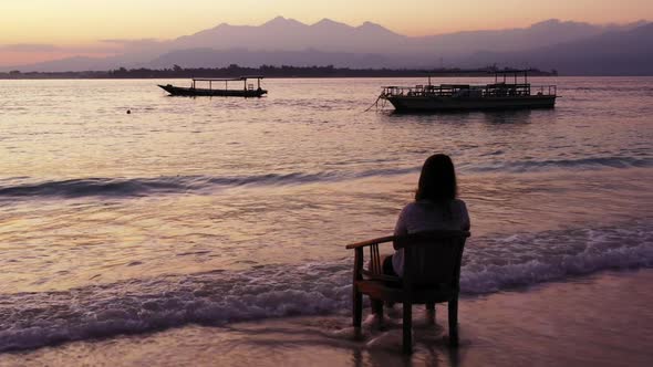 Beautiful ladies sunbathing on marine resort beach journey by blue water and white sandy background  alt