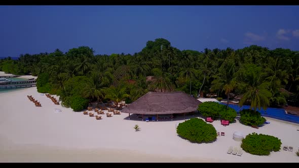 Aerial panorama of idyllic bay beach voyage by blue sea with white sandy background of a dayout befo alt