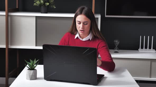 Young Woman Shocked Receiving Very Bad News on Her Laptop Computer Screen Upset and Frustrated with alt