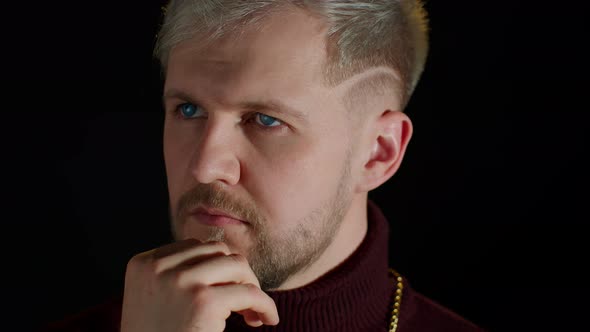 Stylish Man with Blue Eyes in Trendy Clothes Looking at Side Feeling Happiness Fun Enjoyment alt