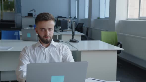 Close Up View of Young Worker That Lays Down on Chair alt
