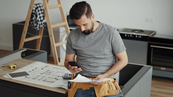 Video of carpenter scrolling through the phone. Shot with RED helium camera in 8K alt