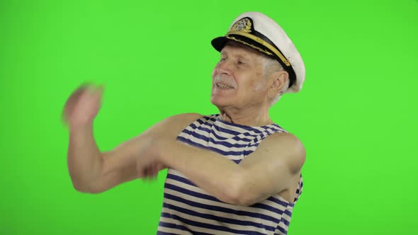 Elderly Sailor Man Funny Dances. Old Sailorman on Chroma Key Background alt